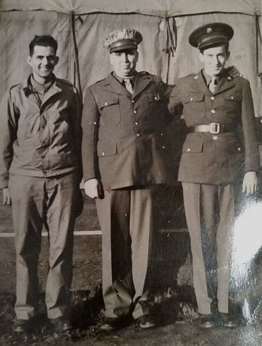 Otis Beliles in the middle of two buddies.