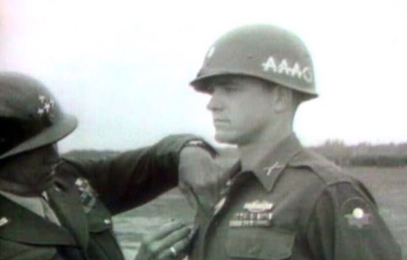 General Patton decorates a member of the 39th Infantry Regiment.