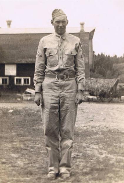 Archie J Sweeney in front of the farm at home.