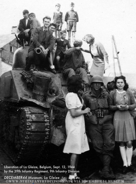 Happy locals pose with GIs of the 39th Infantry Regiment in La Gleize, Belgium, September 12th, 1944.