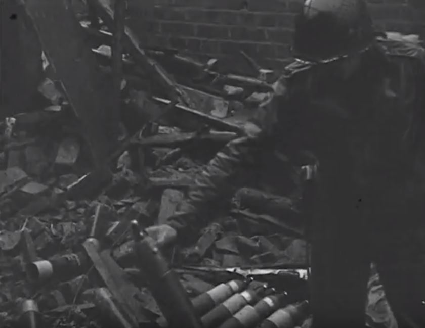 4.2 inch Mortar Crew firing a round.